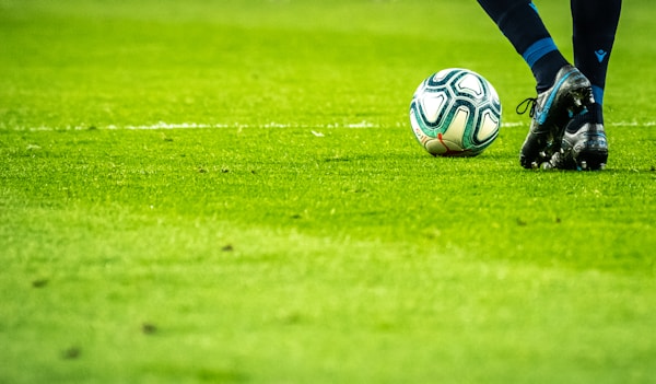 Football player kicking a ball